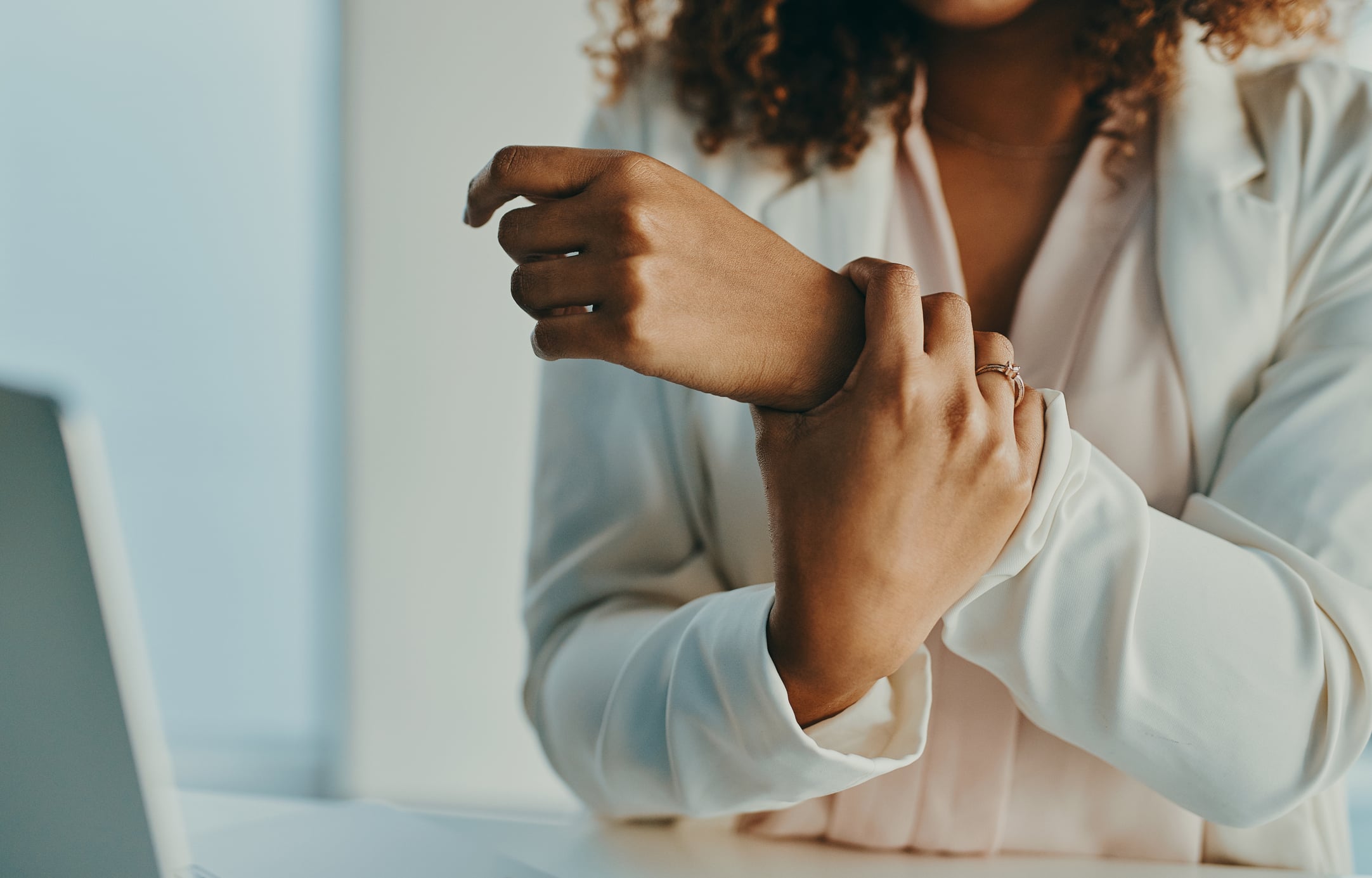 Person with carpal tunnel wrist pain requiring specialized treatment in Costa Mesa chiropractic clinic