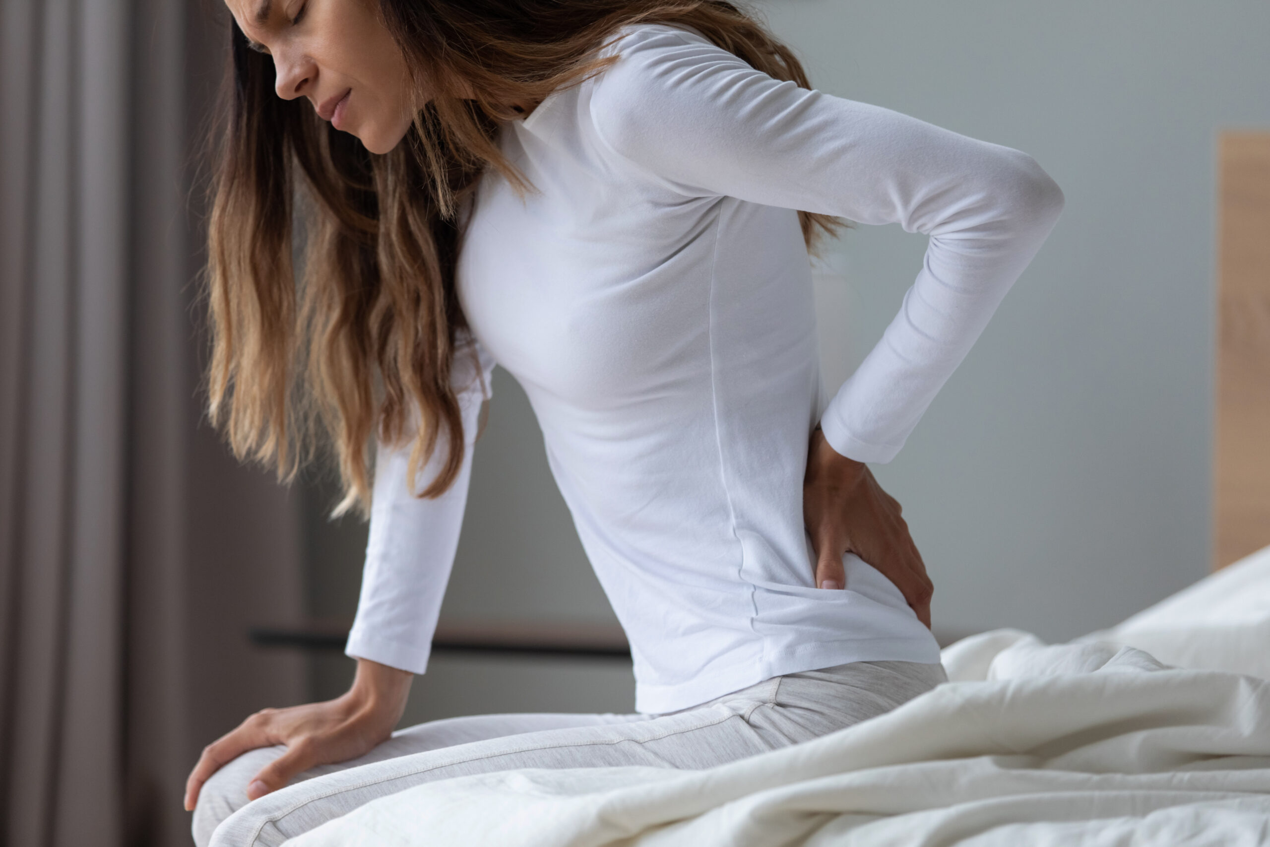 Person with herniated disc back pain requiring treatment in Costa Mesa chiropractic clinic