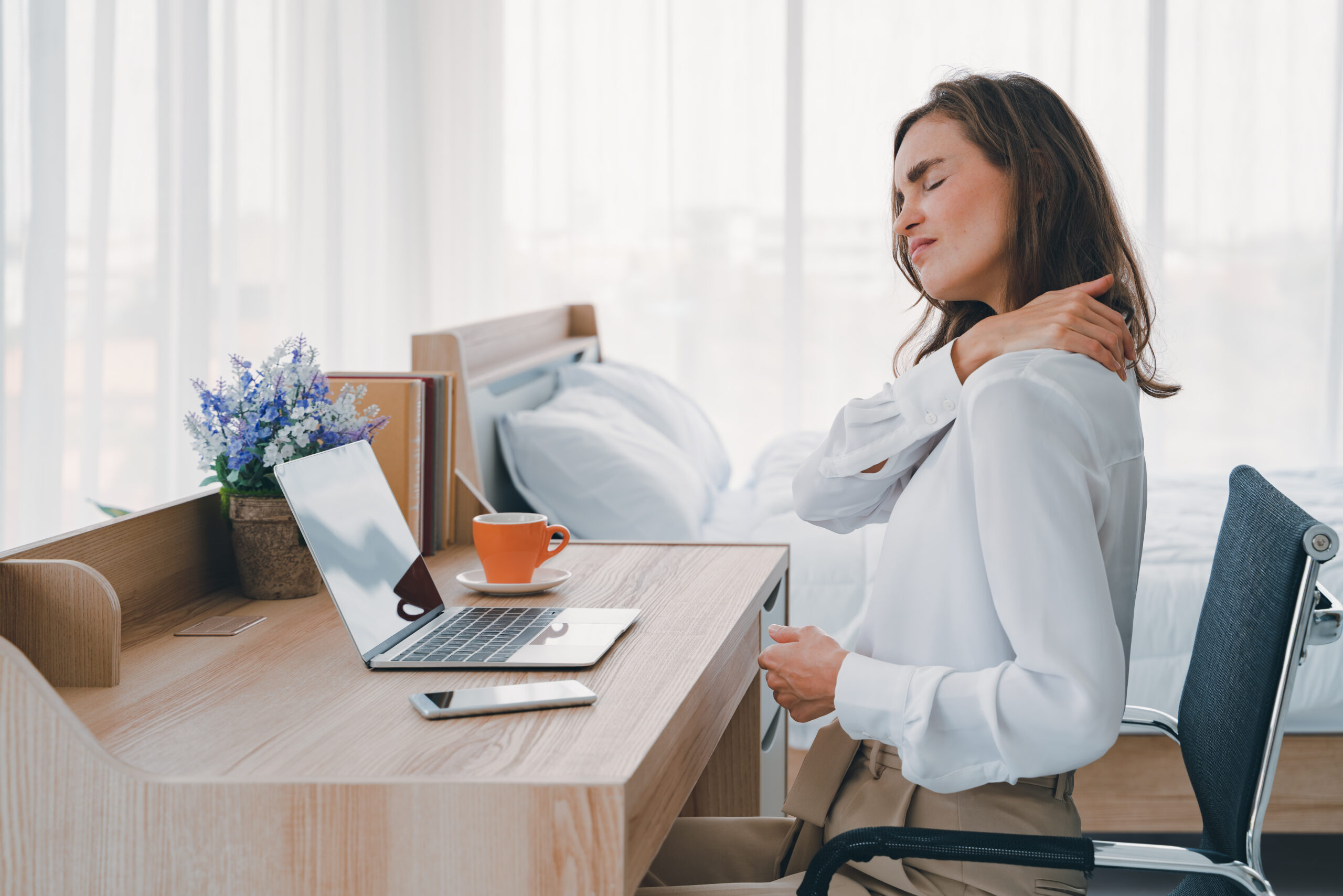 Person with neck pain requiring specialized chiropractic treatment in Costa Mesa