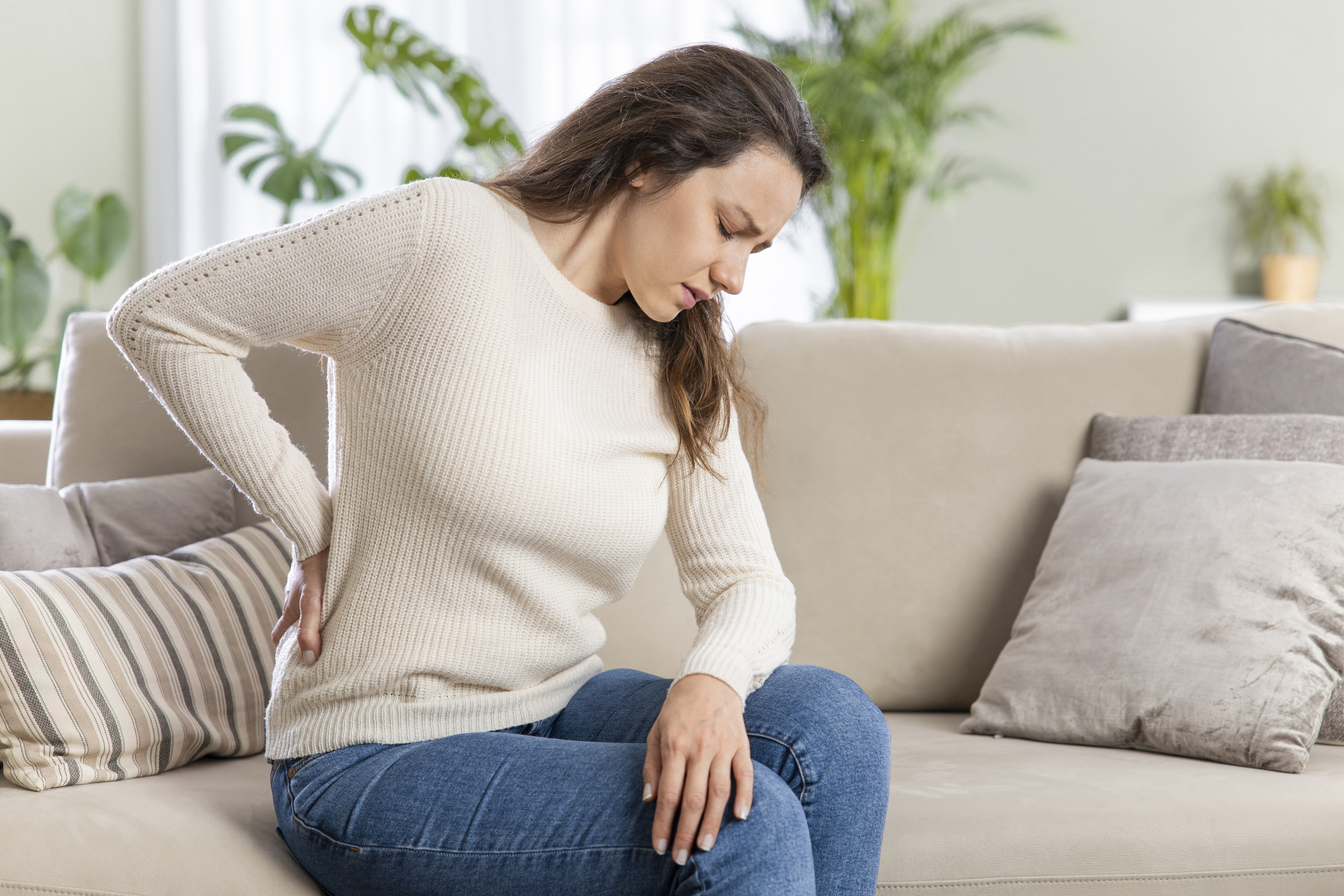 Person with pinched nerve pain requiring specialized treatment in Costa Mesa chiropractic clinic